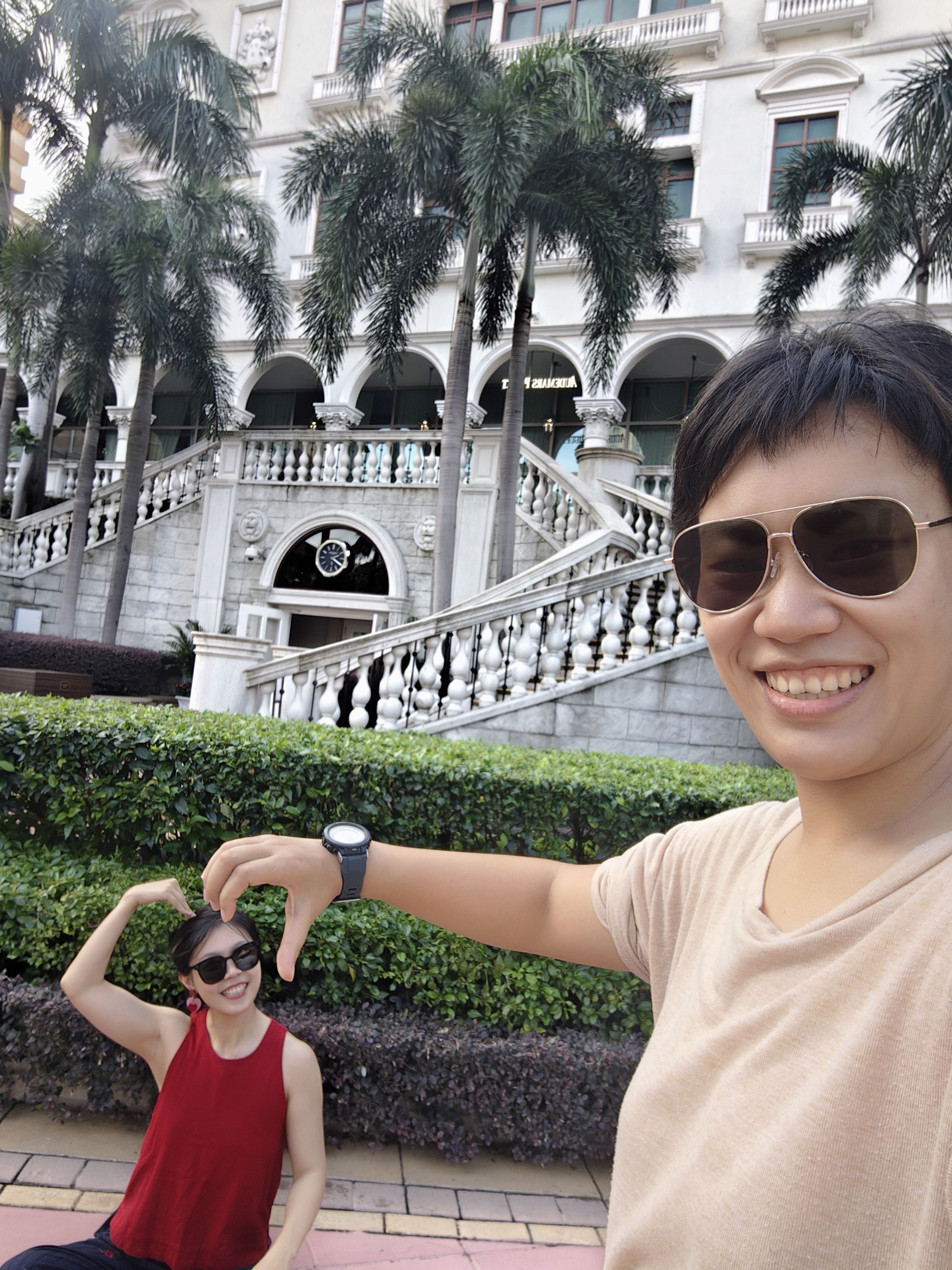 Cherish and Judy making a heart shape at The Venetian Macao